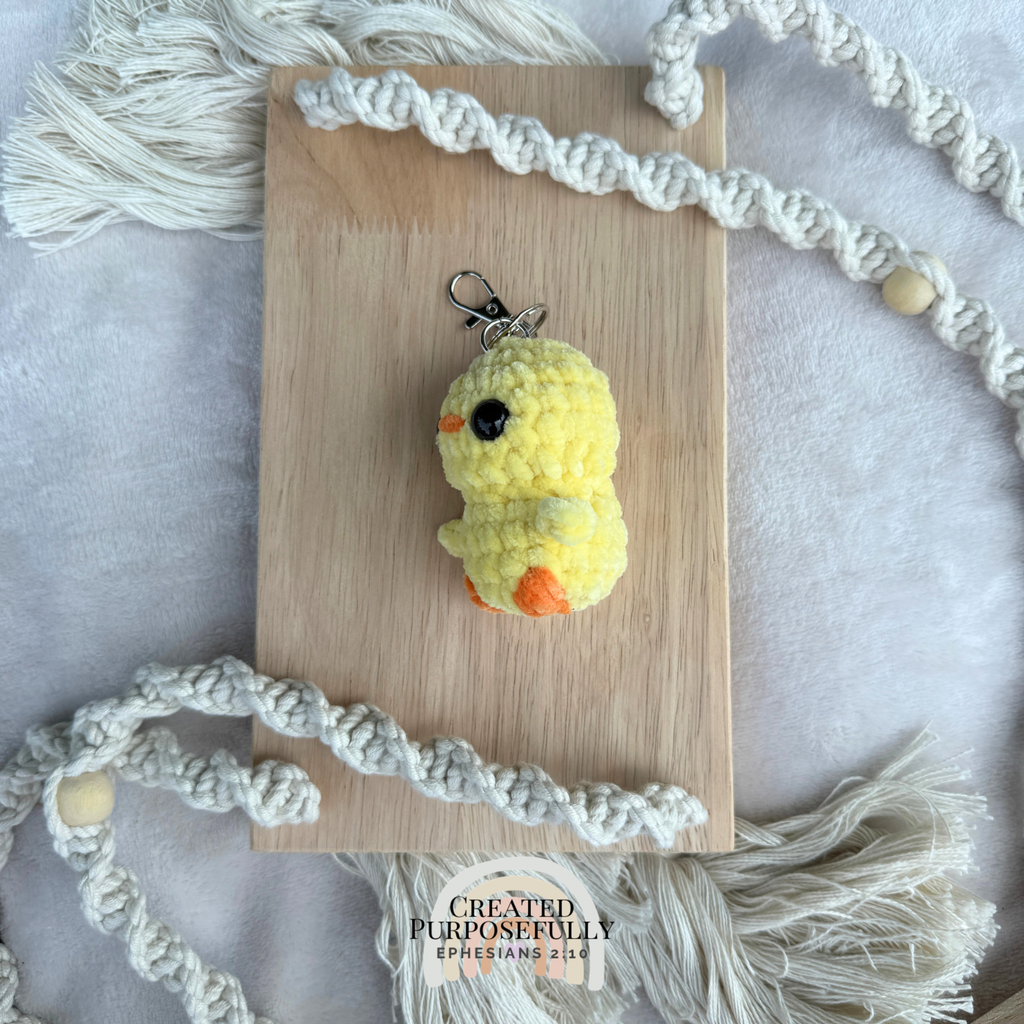 Handmade crochet yellow duck backpack buddy keychain made with soft plush yarn, a cute bag charm for backpacks, purses, keys, and gifts.