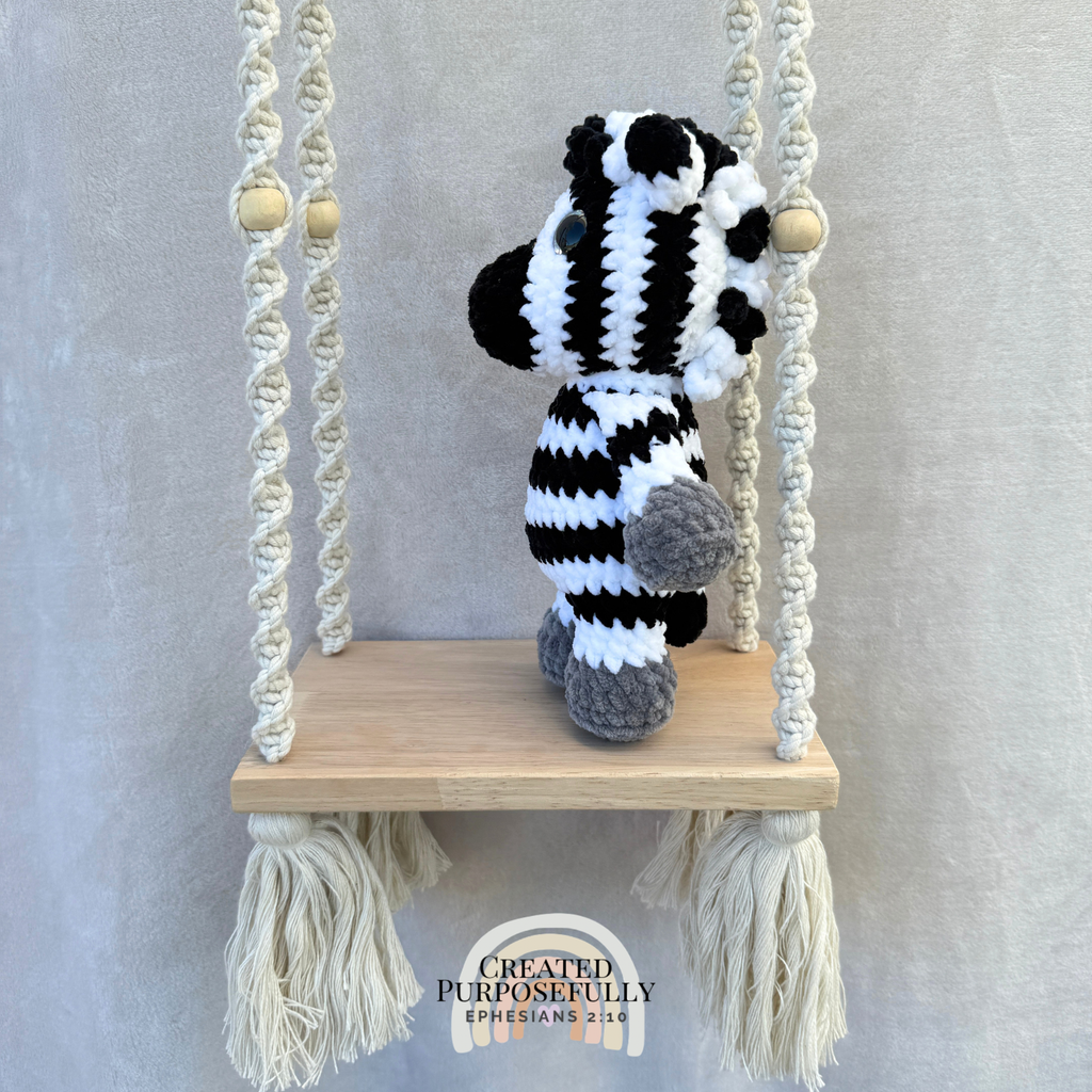 Handmade crochet zebra plush with fun stripes made with soft cuddly yarn by Created Purposefully
