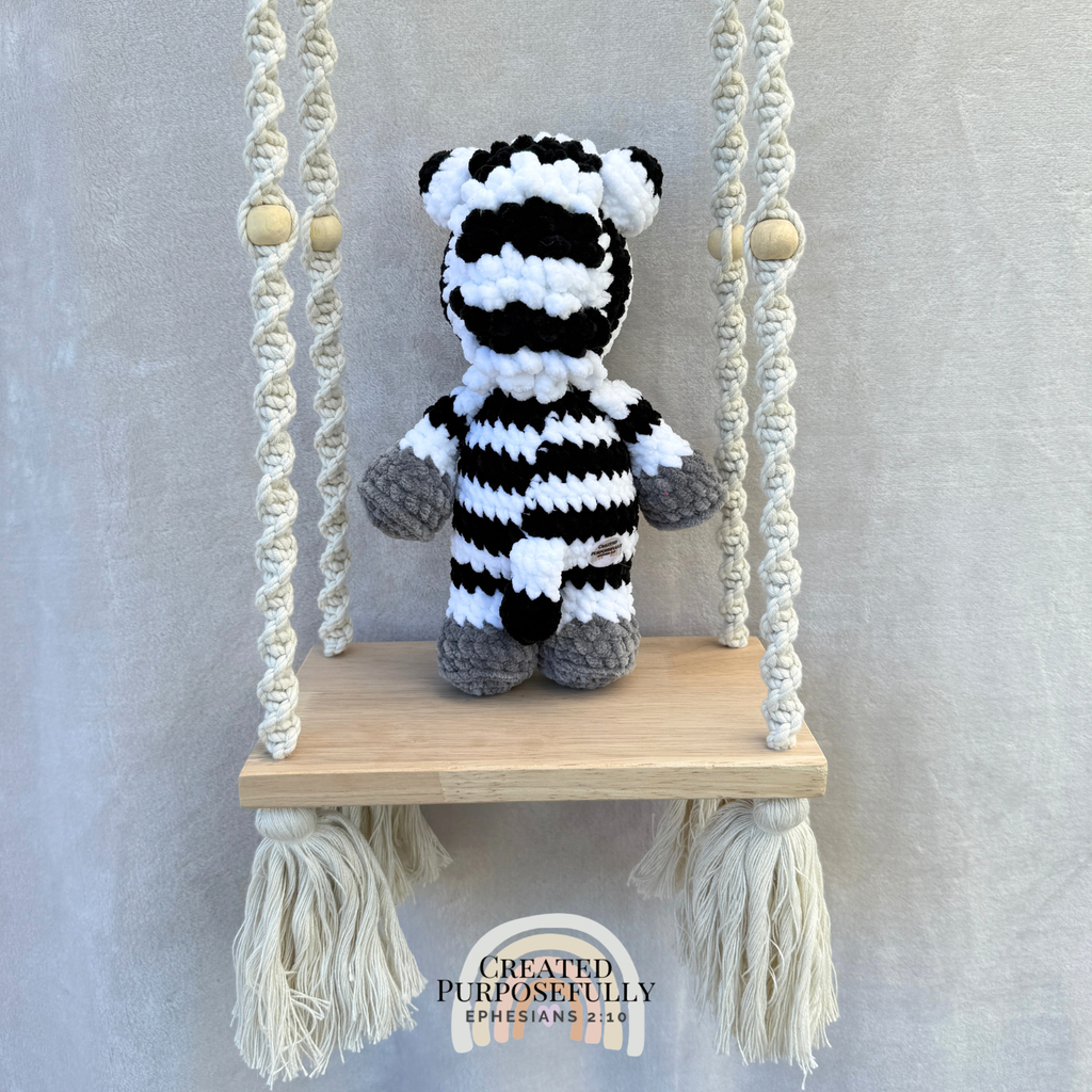 Handmade crochet zebra plush with fun stripes made with soft cuddly yarn by Created Purposefully