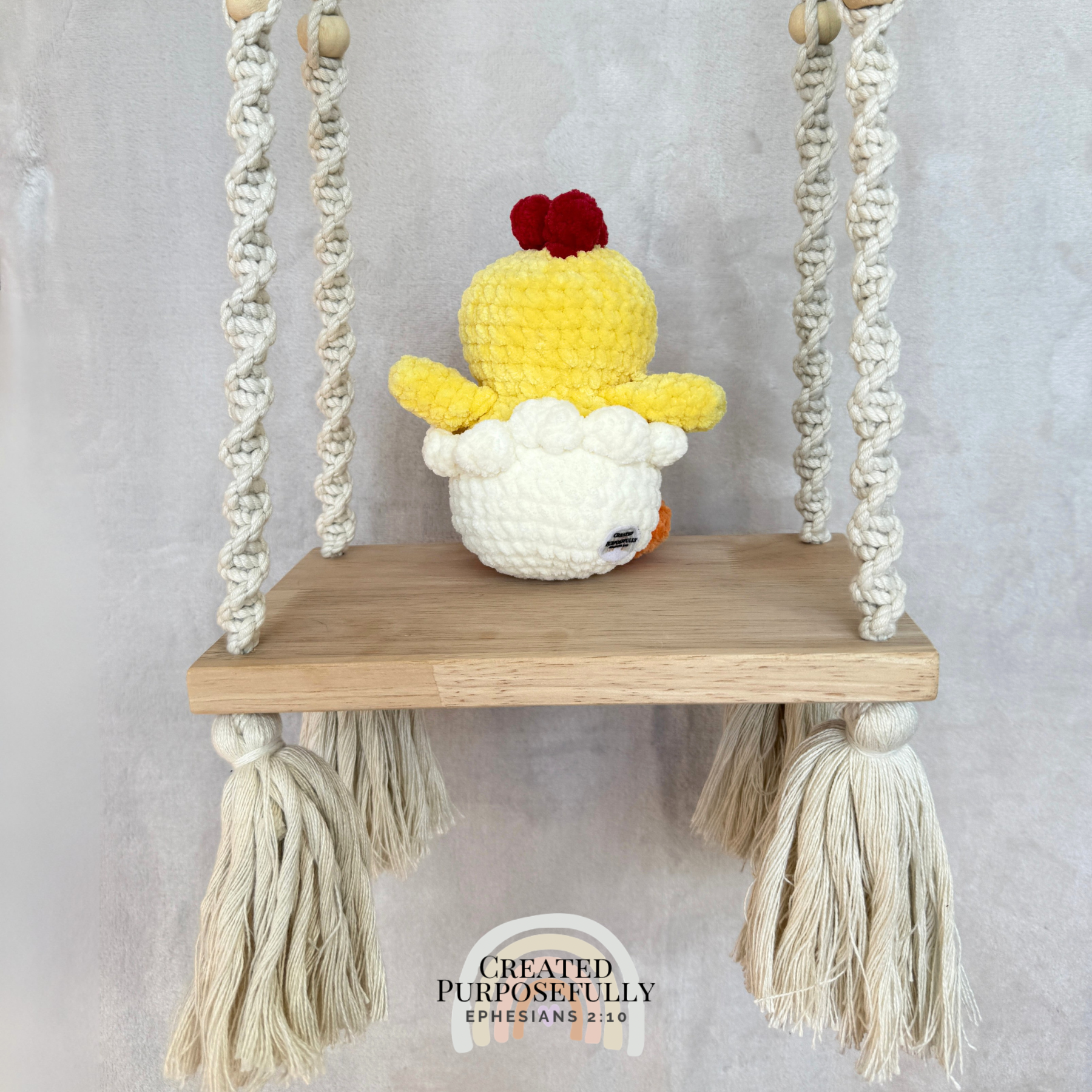 Handmade hatching chick crochet plush peeking from an eggshell made with soft plush yarn