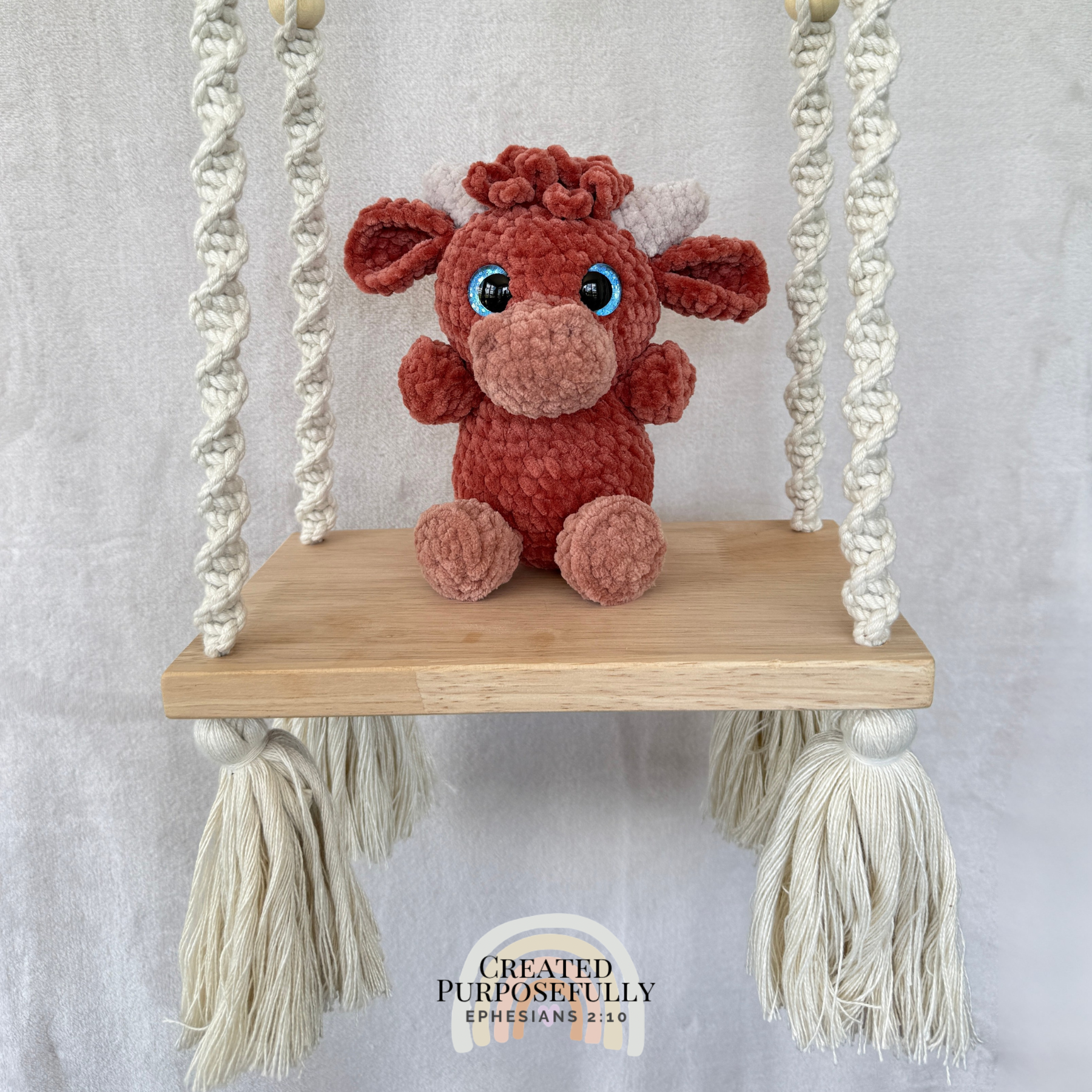 Handmade Highland cow crochet plush made with soft plush yarn and adorable handmade details