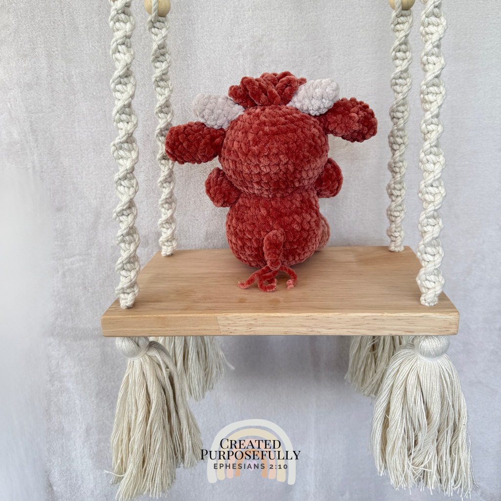 Handmade Highland cow crochet plush made with soft plush yarn and adorable handmade details
