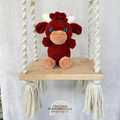 Handmade Highland cow crochet plush made with soft plush yarn and adorable handmade details