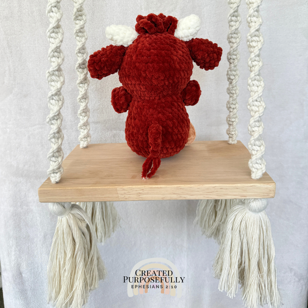 Handmade Highland cow crochet plush made with soft plush yarn and adorable handmade details