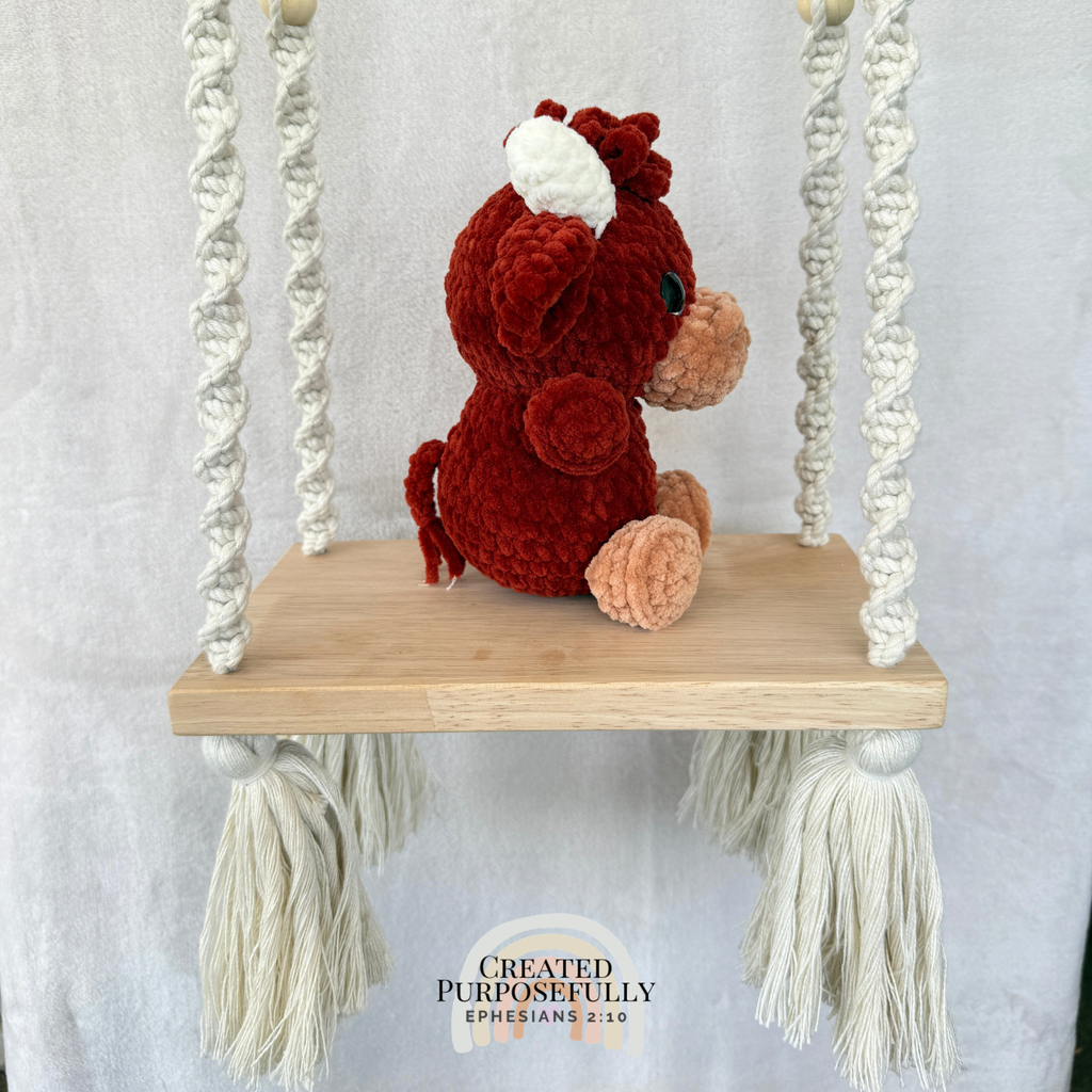 Handmade Highland cow crochet plush made with soft plush yarn and adorable handmade details