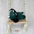 Handmade laying triceratops crochet plush made with soft plush yarn and adorable dinosaur details