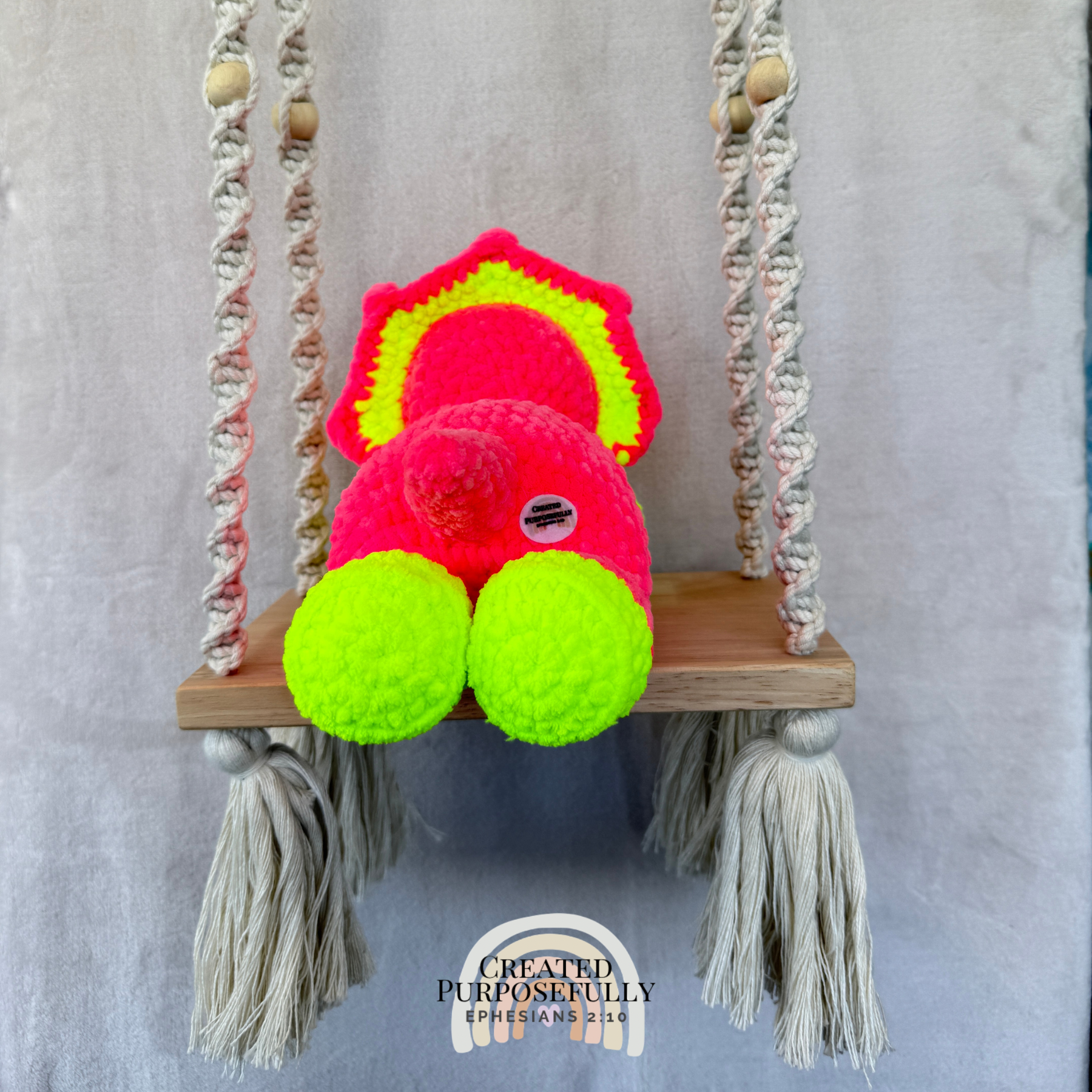 Handmade laying triceratops crochet plush made with soft plush yarn and adorable dinosaur details