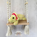 Handmade laying triceratops plush made with soft plush yarn and adorable dinosaur details