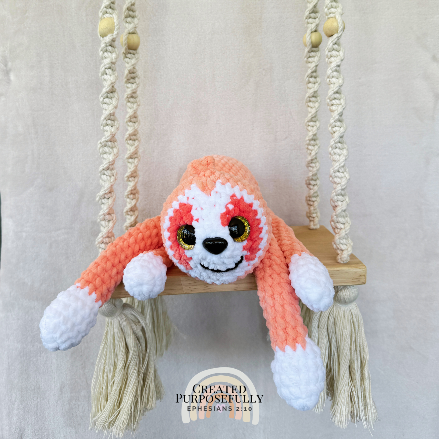 Handmade peach crochet sloth plush made with soft plush yarn and adorable handmade details