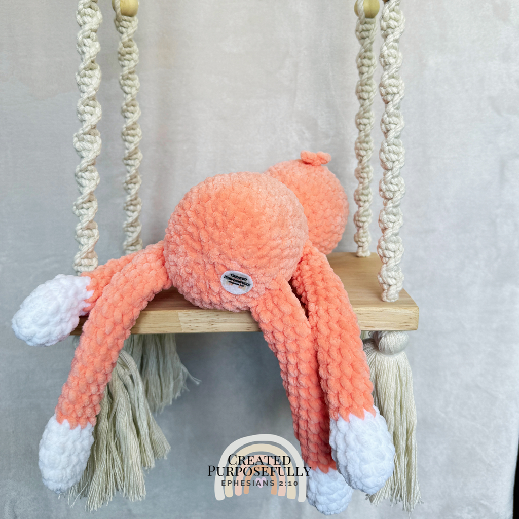 Handmade peach crochet sloth plush made with soft plush yarn and adorable handmade details