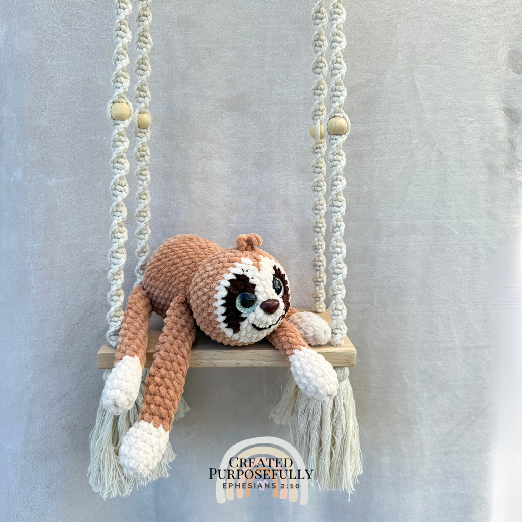 Handmade peach crochet sloth plush made with soft plush yarn and adorable handmade details