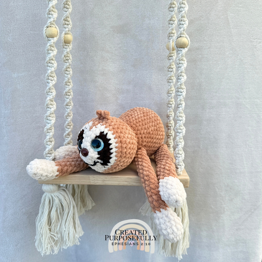 Handmade peach crochet sloth plush made with soft plush yarn and adorable handmade details