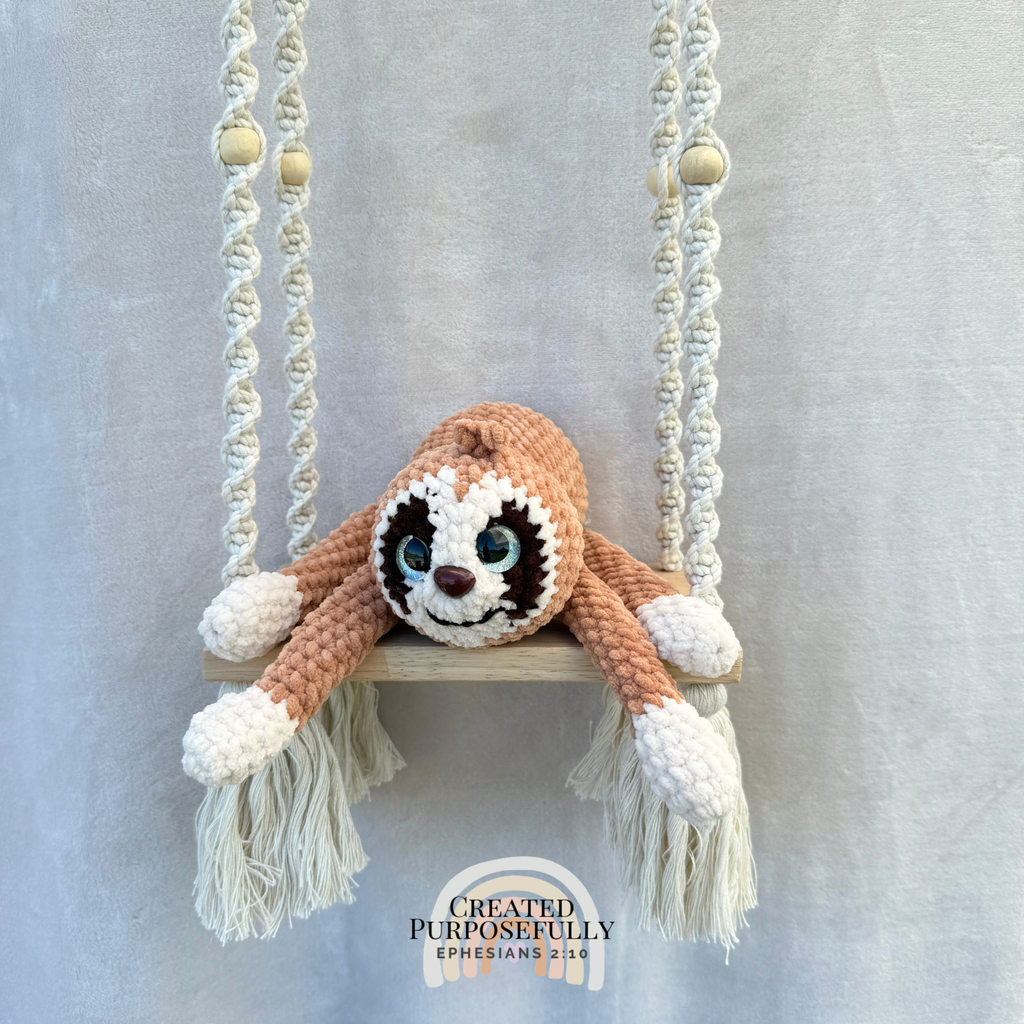 Handmade peach crochet sloth plush made with soft plush yarn and adorable handmade details