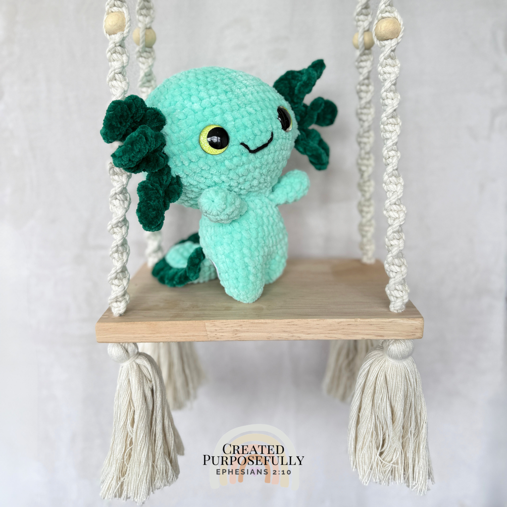 Handmade standing axolotl crochet plush made with soft plush yarn and adorable handmade details