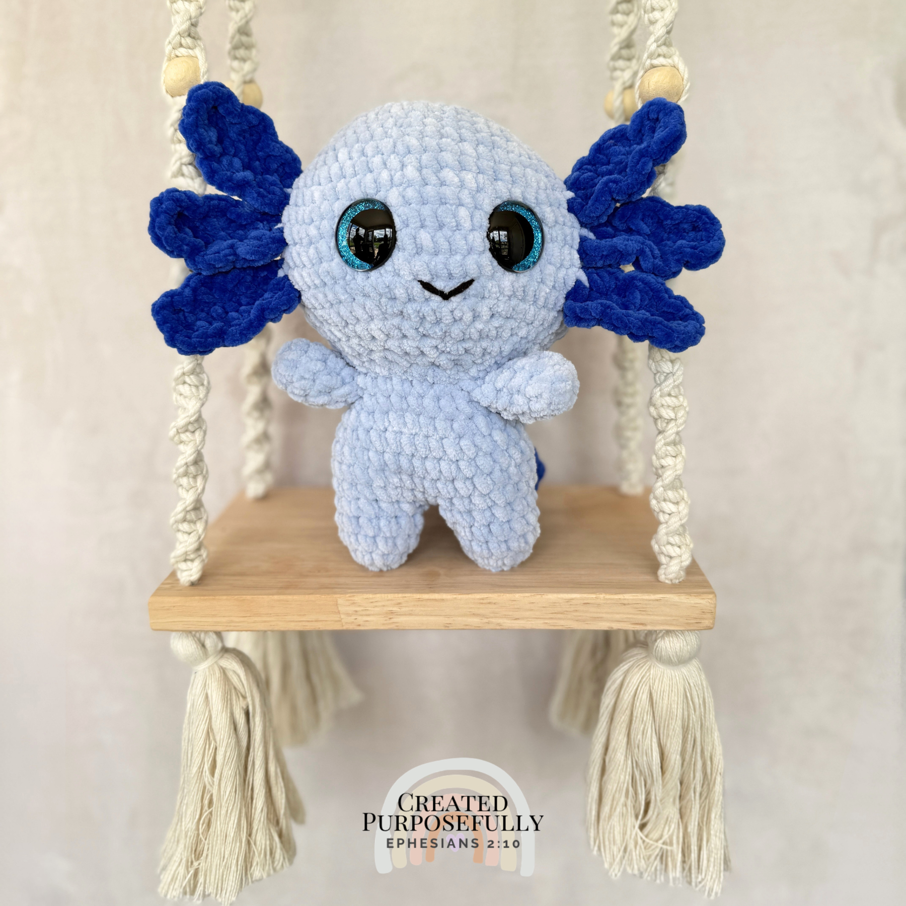 Handmade standing axolotl crochet plush made with soft plush yarn and adorable handmade details