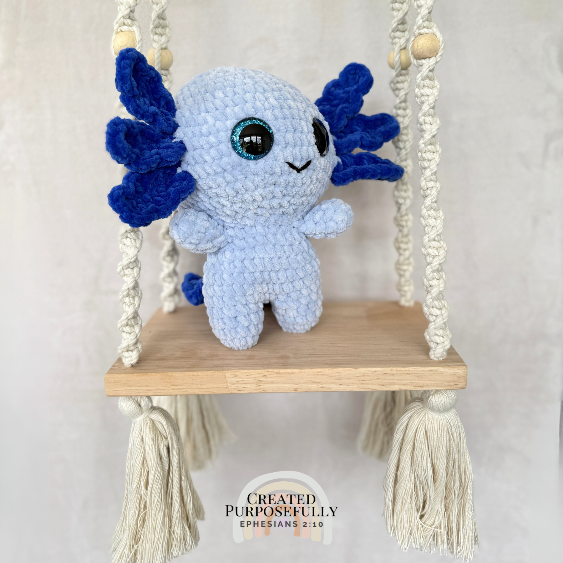 Handmade standing axolotl crochet plush made with soft plush yarn and adorable handmade details