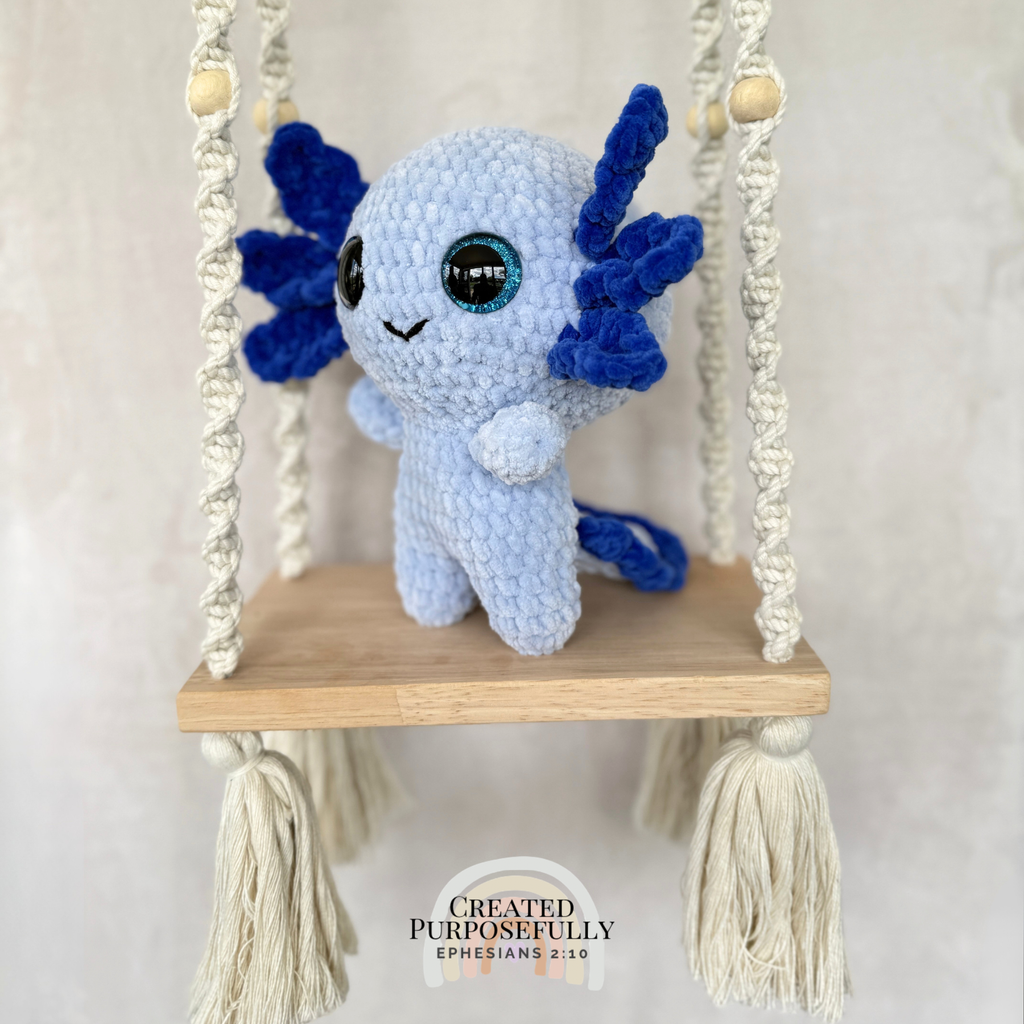 Handmade standing axolotl crochet plush made with soft plush yarn and adorable handmade details