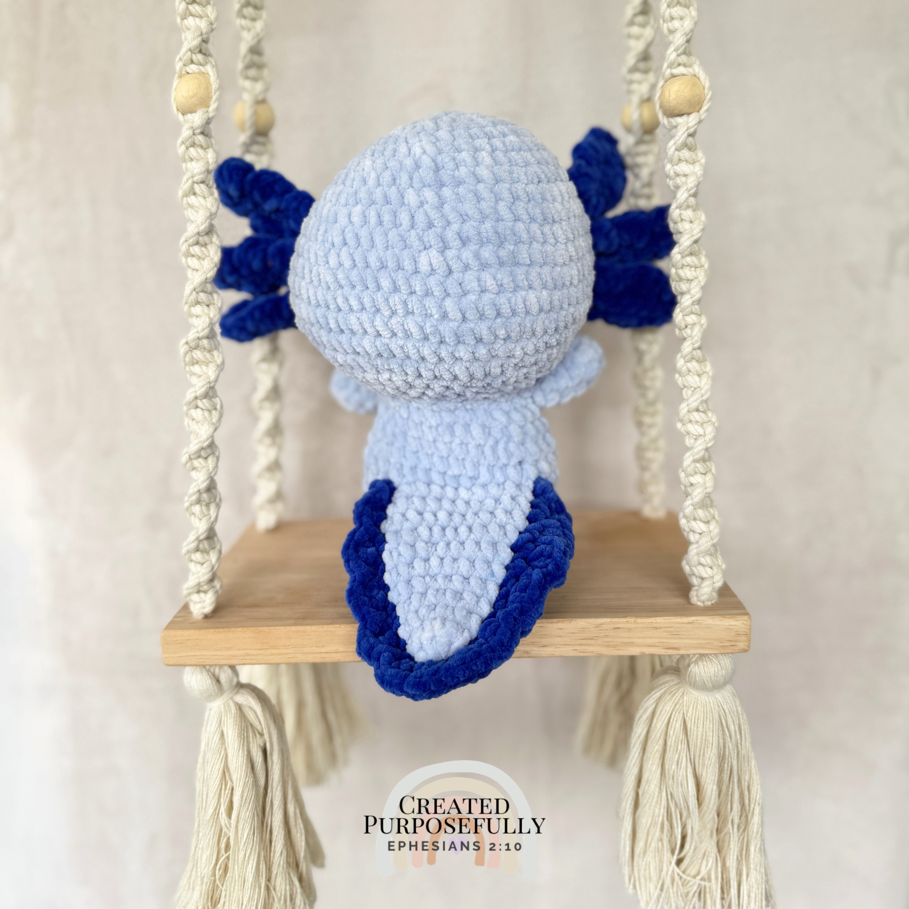 Handmade standing axolotl crochet plush made with soft plush yarn and adorable handmade details