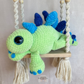 Handmade stegosaurus crochet plush made with soft plush yarn and adorable dinosaur details