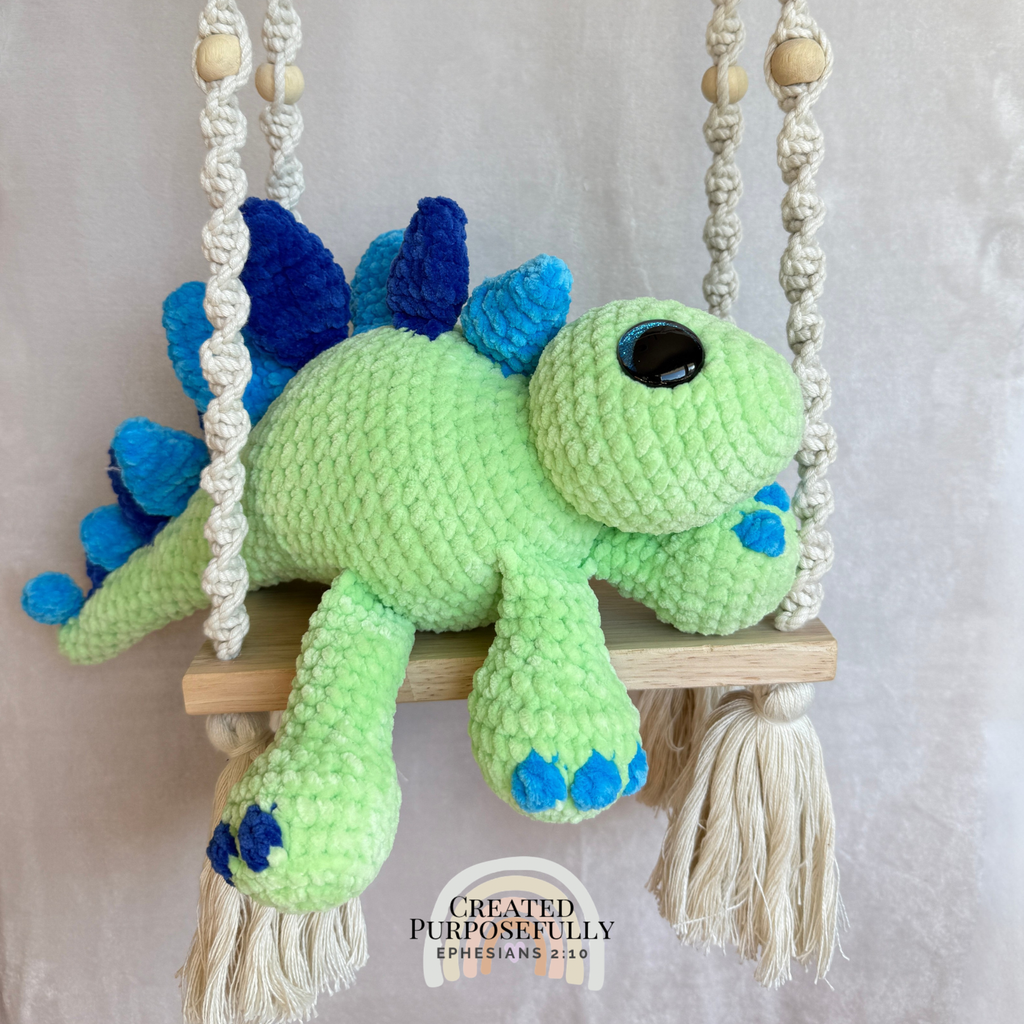 Handmade stegosaurus crochet plush made with soft plush yarn and adorable dinosaur details