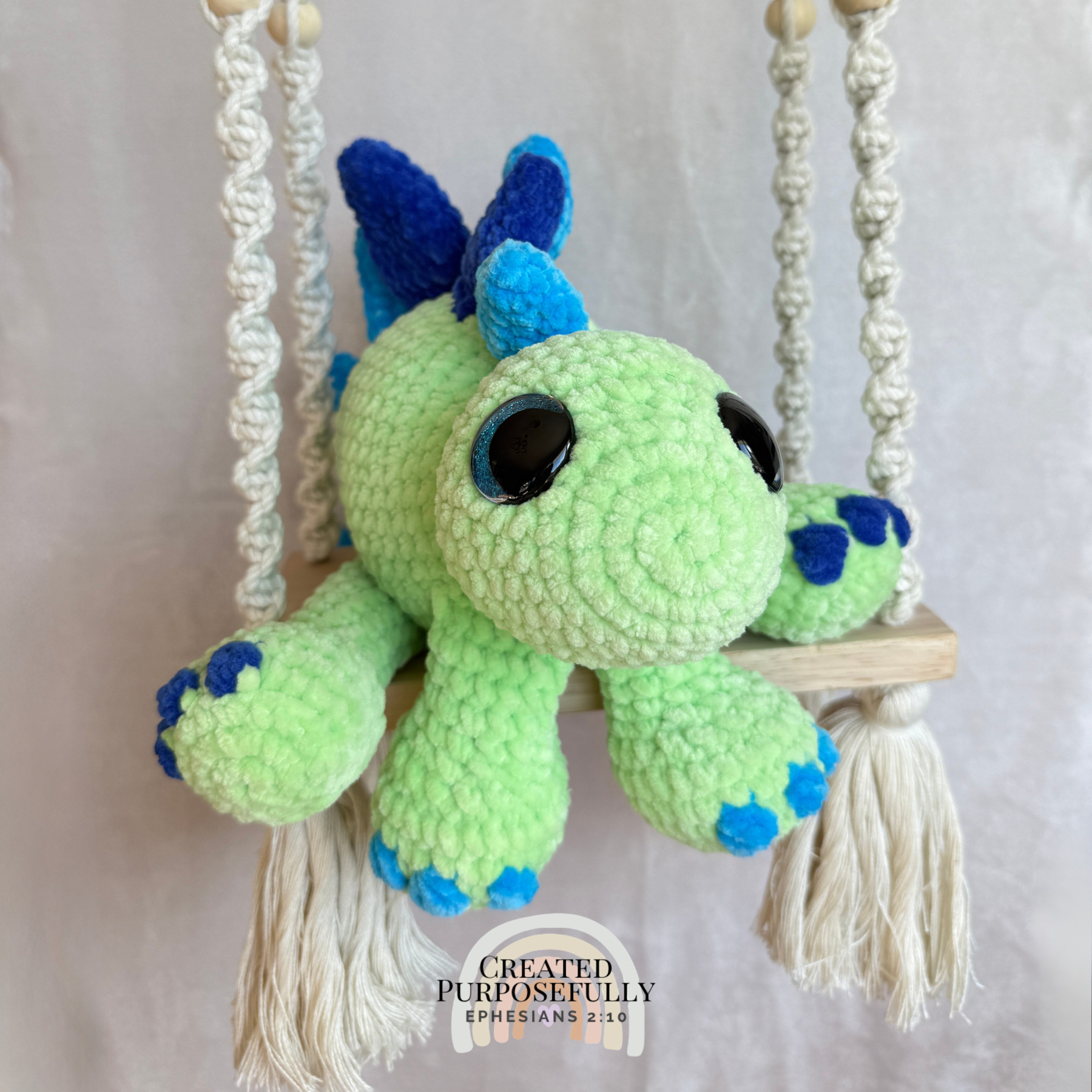 Handmade stegosaurus crochet plush made with soft plush yarn and adorable dinosaur details