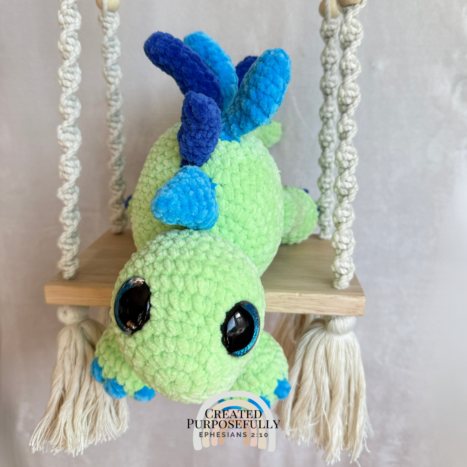 Handmade stegosaurus crochet plush made with soft plush yarn and adorable dinosaur details