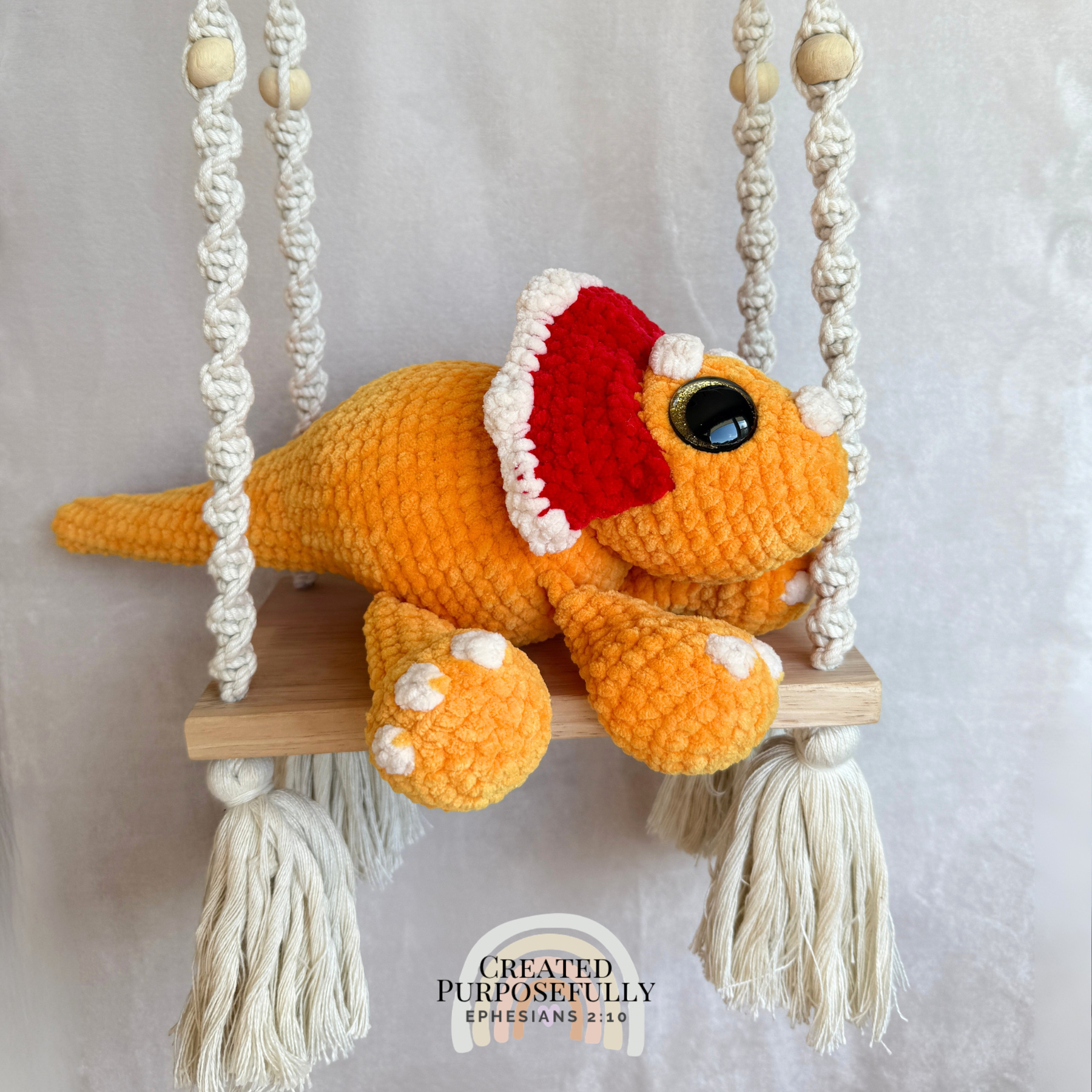 Handmade triceratops crochet plush made with soft plush yarn and adorable dinosaur details